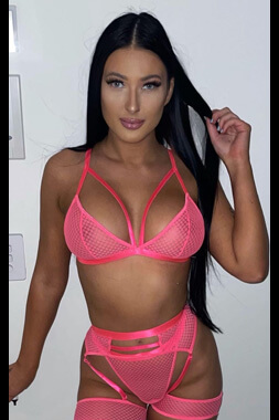 sexy lingerie waitress in see-through pink underwear playing with her hair in arundel on the gold coast